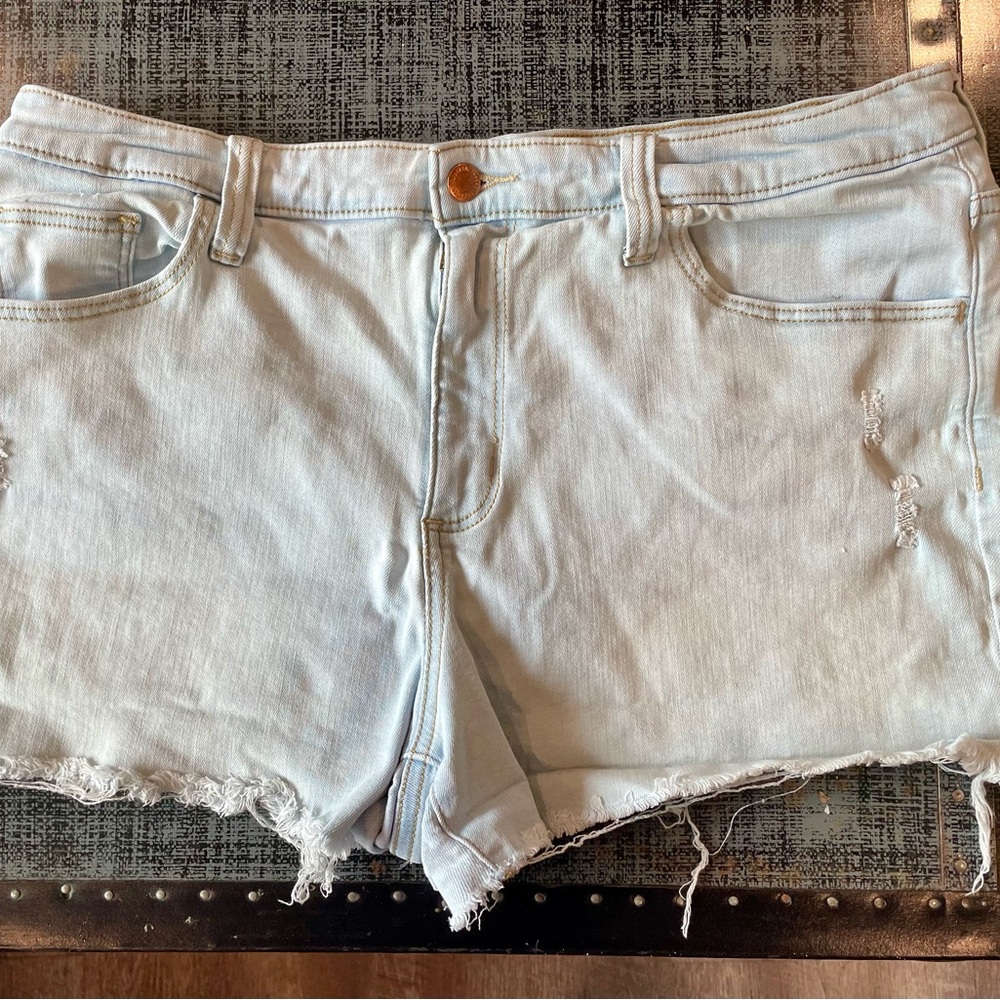 Distressed light blue universal thread denim shorts. Size 16